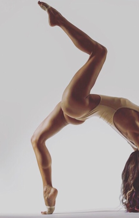 Dancer in artistic pose against white background